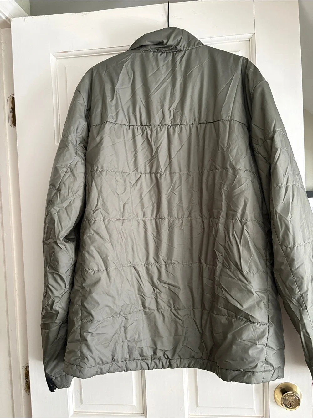 The North Face Men's Puffer Jacket - Olive Green light weight.